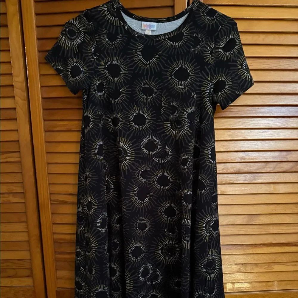 LuLaRoe Carly High Low Hem Dress  Black and Gold Graphic Starbursts. Size is XS